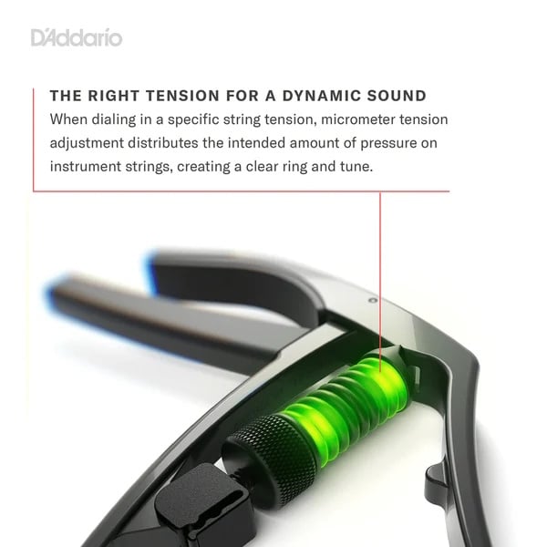 Close-up of a string tensioning tool with a bright green spring, showing the tool's jaws near the handle.