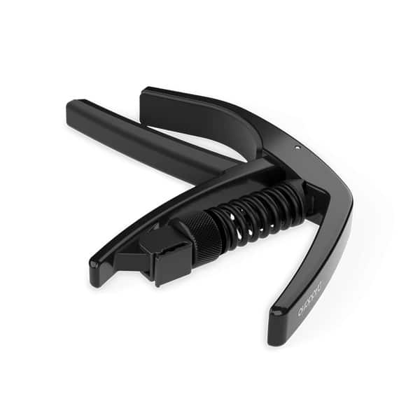 Black spring-loaded hand clamp with two curved arms and a central coiled spring, used to grip or secure objects.